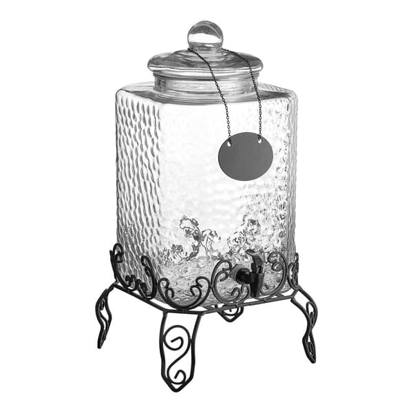An Acopa glass beverage dispenser with a black metal stand and a chalkboard tag.