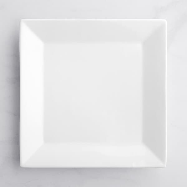 An Acopa bright white square porcelain plate on a white background.