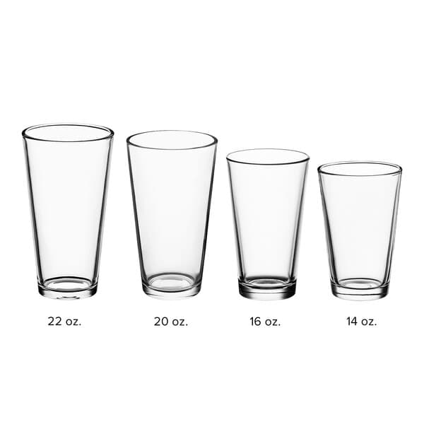 A row of clear Acopa mixing glasses with measurements.
