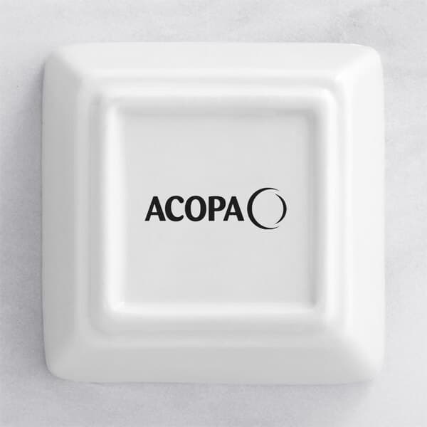 A white square Acopa porcelain sauce cup.