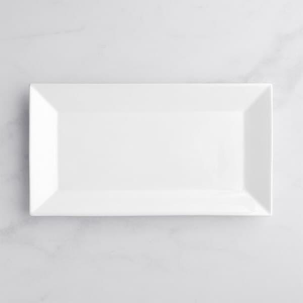 A white rectangular Acopa porcelain platter on a white surface.