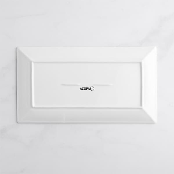 A white rectangular Acopa porcelain platter with black text on it.