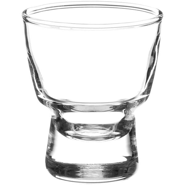 An Acopa Select clear glass sake shot glass with a short rim.