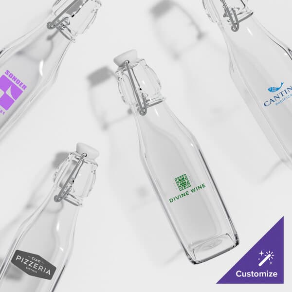 A group of Acopa clear glass bottles with wire bail swing top lids.