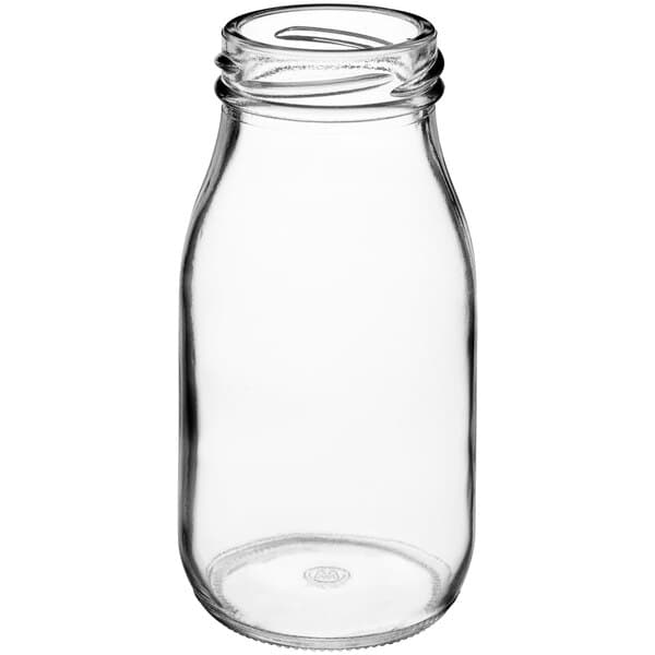 An Acopa clear glass milk bottle with a lid.