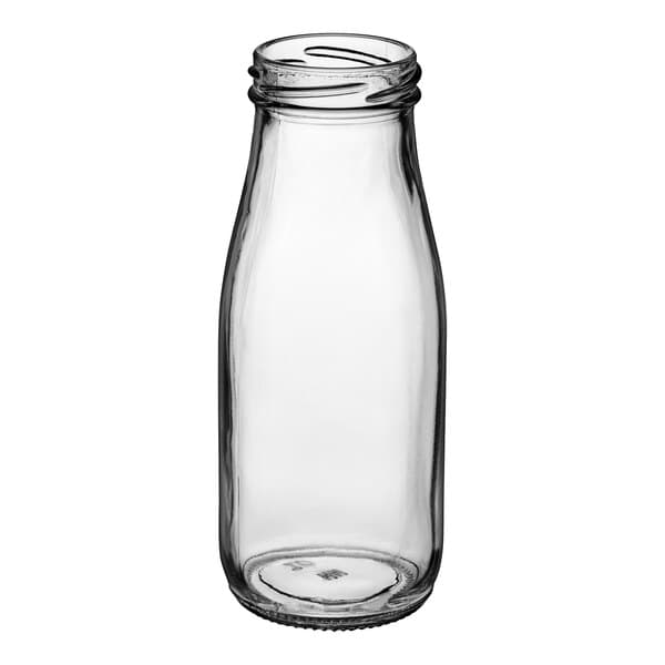 An Acopa clear glass milk bottle with a lid.