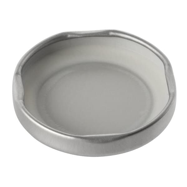 A close-up of a silver metal Acopa milk bottle lid.