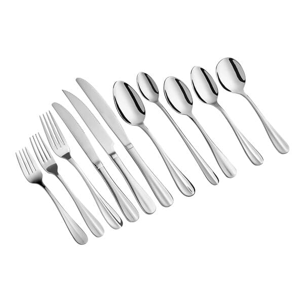 A close-up of several Acopa Benson stainless steel serving spoons.