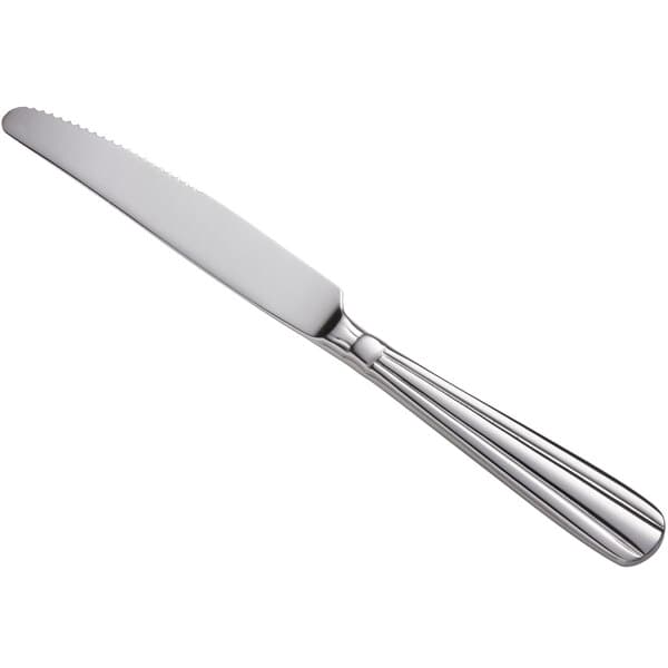 An Acopa Harmony stainless steel dinner knife with a white handle.
