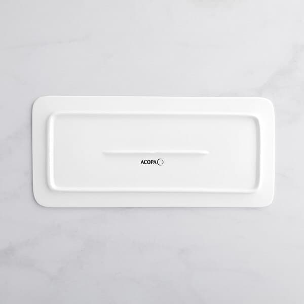 A white rectangular Acopa porcelain plate with black text.