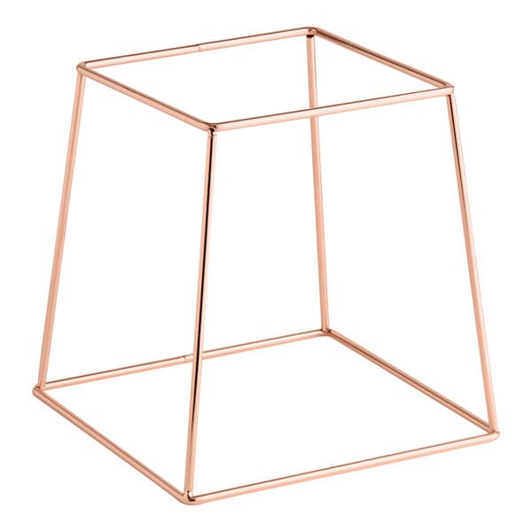 A rose gold metal display stand with a square base and open geometric design.