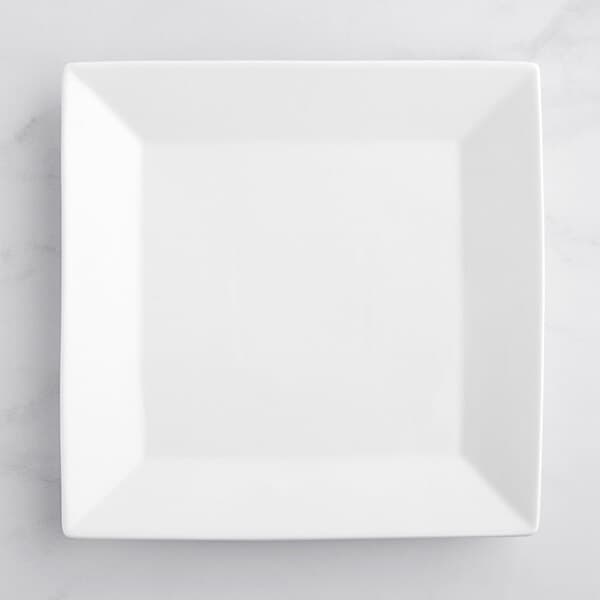 An Acopa bright white square porcelain plate on a white background.