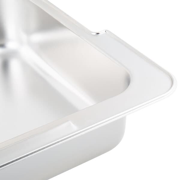 An Acopa stainless steel water pan for a chafer on a counter.
