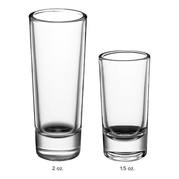 Two Acopa shooter glasses filled with white liquid.
