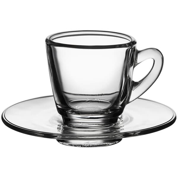 An Acopa clear glass espresso cup and saucer set.