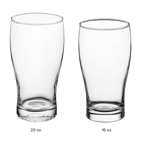 An Acopa Pub glass filled with beer on a white background.