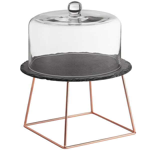 A slate cake stand with a rose gold wire base.