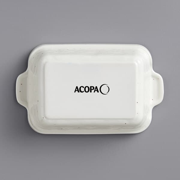 A white rectangular Acopa stoneware casserole dish with black text.