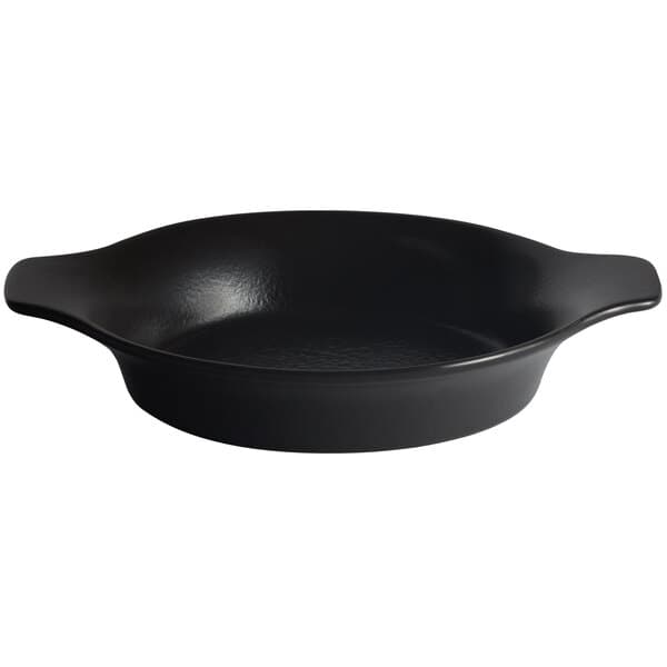 A black round Acopa stoneware dish with handles.