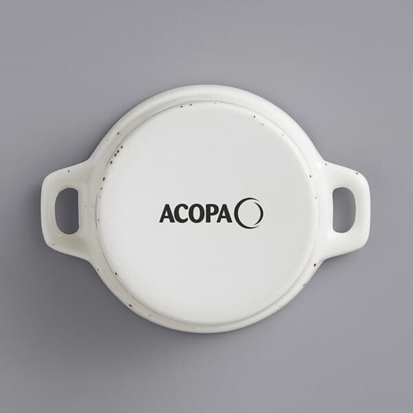 A white round Acopa stoneware mini casserole dish with black text.