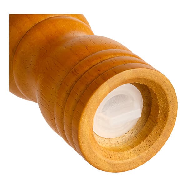 A close-up of a wooden Acopa pepper mill with a white cap.