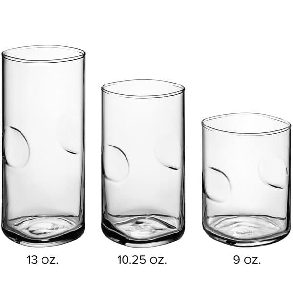 A set of clear glass Acopa Thumbprint Rocks and Beverage glasses on a white background.