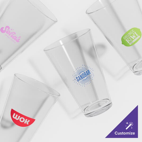 A group of Acopa highball/beer glasses with custom logos on them.