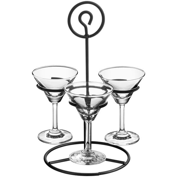 An Acopa metal stand holding three martini glasses.