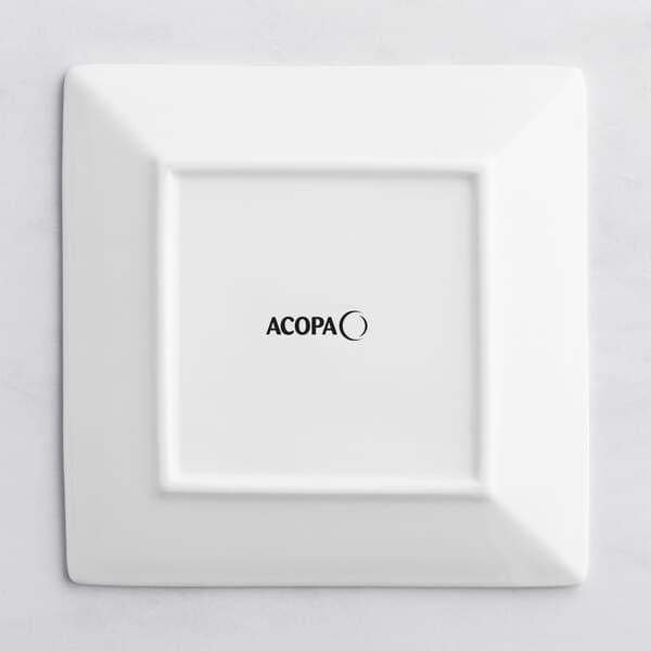 A bright white square Acopa porcelain plate with black text reading "Acopa"