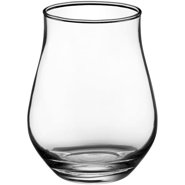 An Acopa Select stemless tulip glass with a small amount of beer in it.