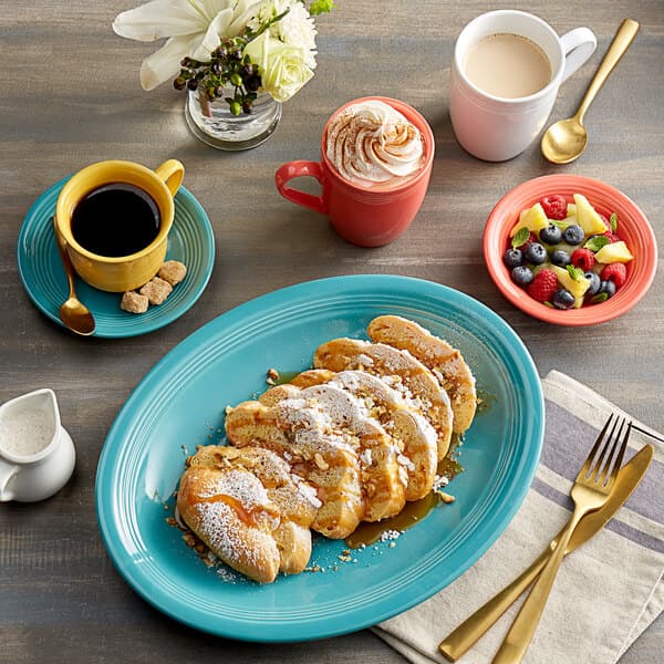 A plate of food and coffee on a table.