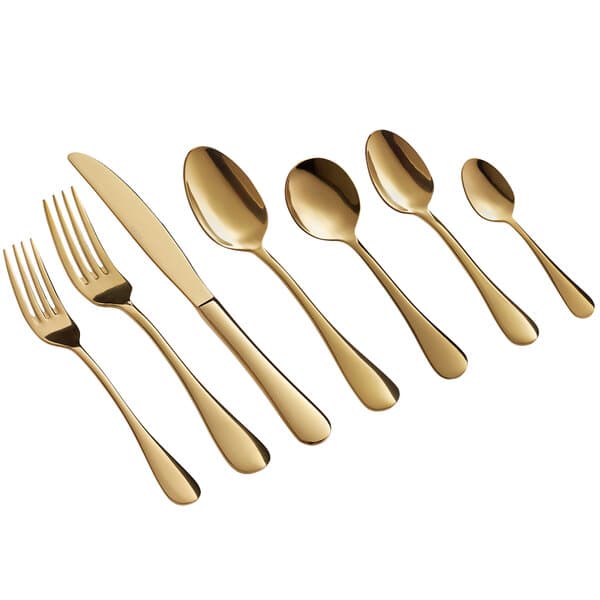 A close-up of a gold Acopa Vernon stainless steel dinner fork.
