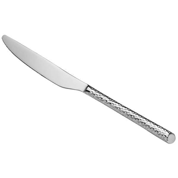 An Acopa Iris stainless steel dinner knife with a textured handle.