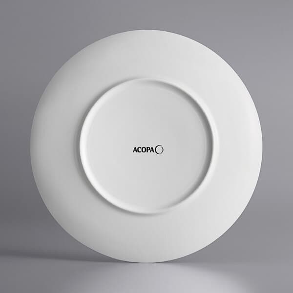 An Acopa bright white porcelain plate with embossed lines and black text that says "Liana"