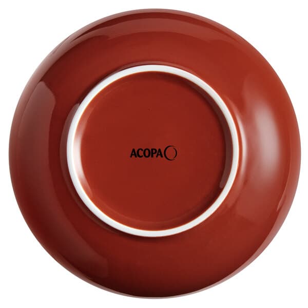 An Acopa Keystone Sedona Orange stoneware bowl with a white rim.