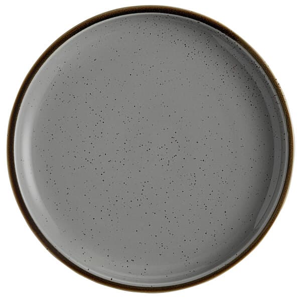 A close-up of an Acopa Keystone granite gray stoneware coupe plate with speckles.
