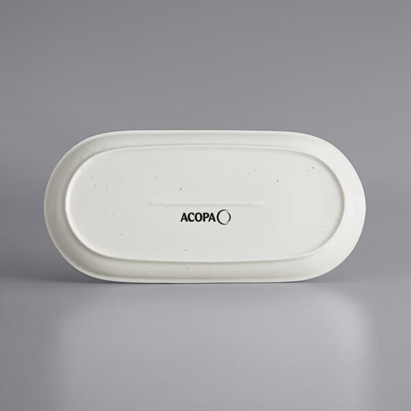 A white oblong Acopa Keystone stoneware platter with black text.