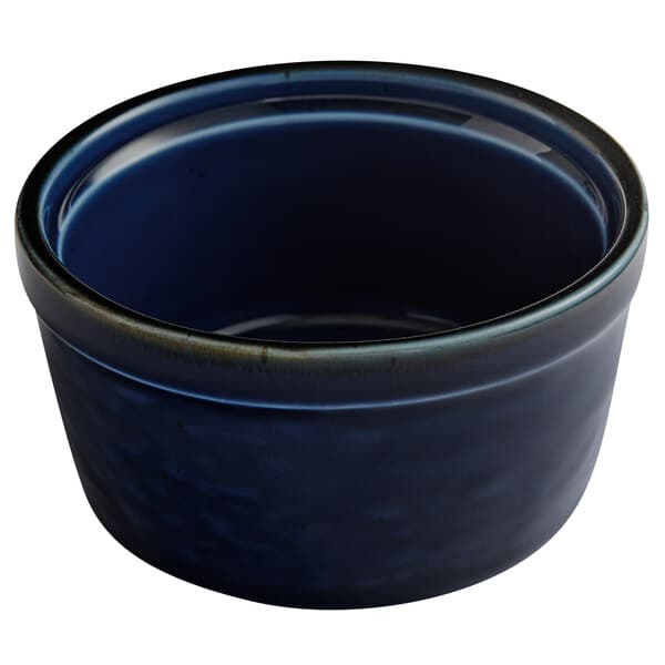 An Acopa Keystone Azora Blue stoneware ramekin with a black rim.