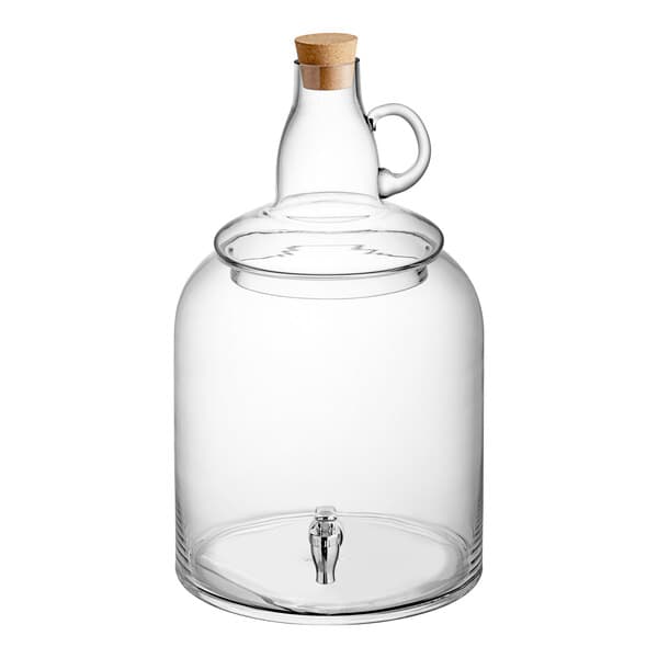 An Acopa clear glass jar with a handle and a cork lid.