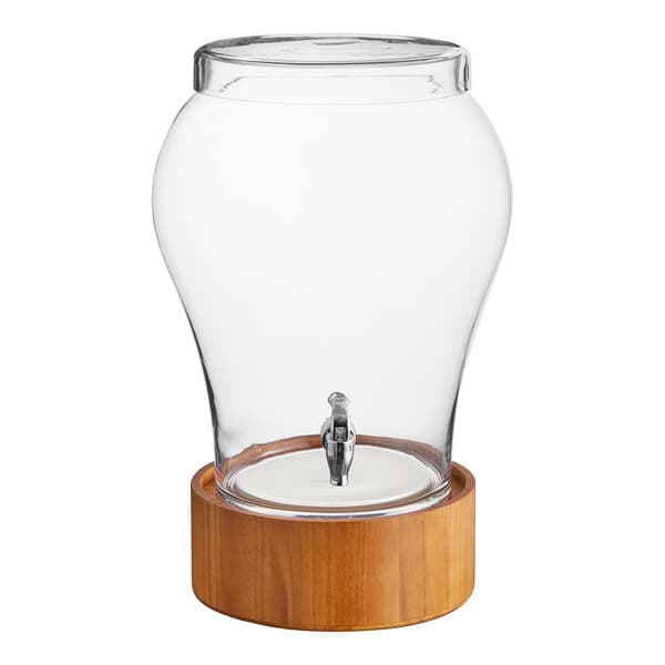 An Acopa glass beverage dispenser with a wood base and spigot.