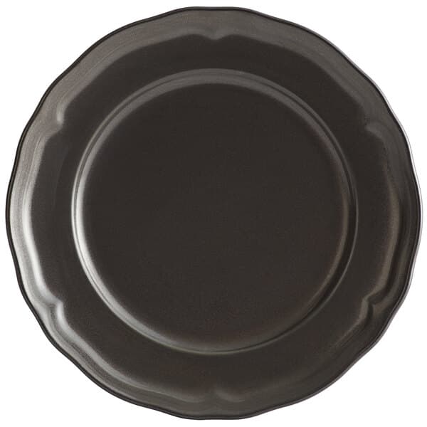 An Acopa Condesa Armor Gray porcelain plate with a scalloped rim.