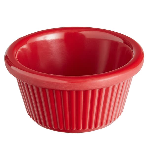 a red bowl with a white background