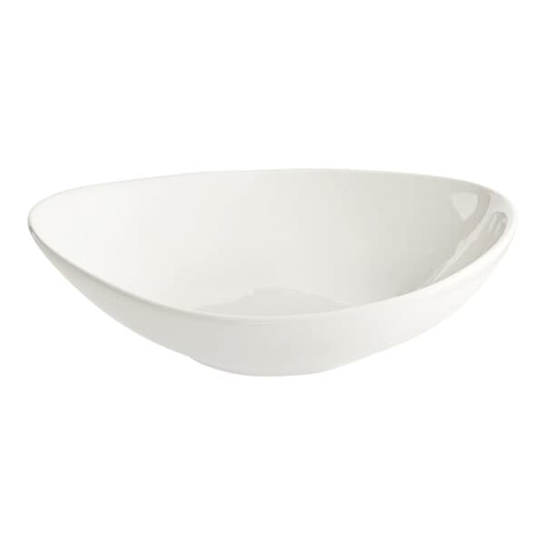 A close up of an Acopa Nova cream white stoneware bowl with an asymmetrical rim.