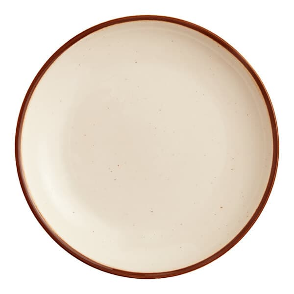A round, cream-colored stoneware plate with a brown rim.