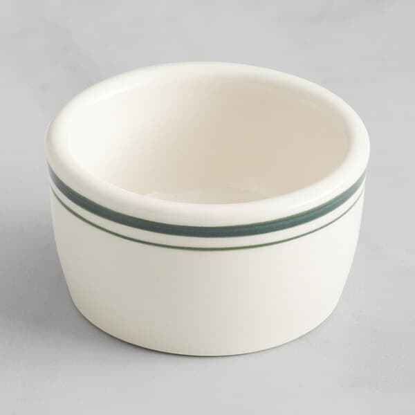 An Acopa ivory stoneware ramekin with green stripes.