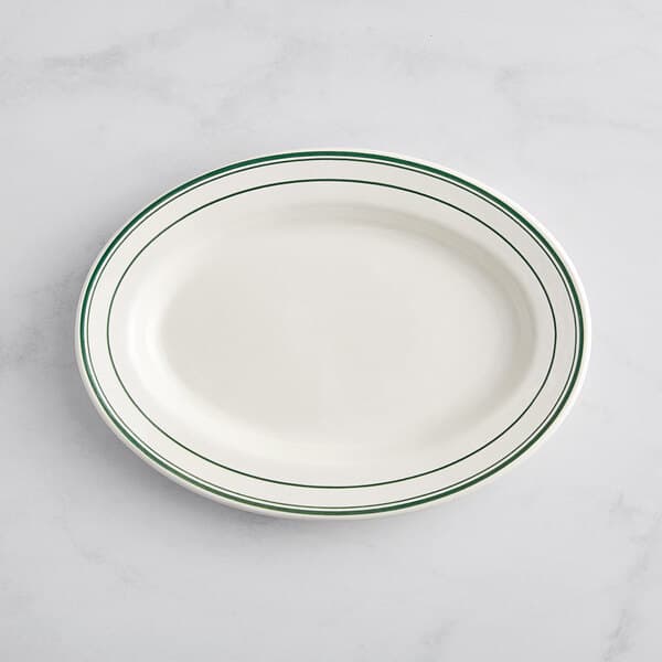An Acopa ivory stoneware platter with green lines on it.