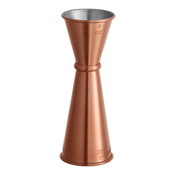 An Acopa copper Japanese jigger with a handle.