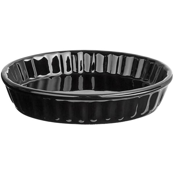 An Acopa glossy black fluted stoneware oval souffle dish.