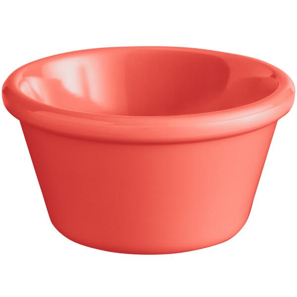 An Acopa Foundations orange smooth melamine ramekin.