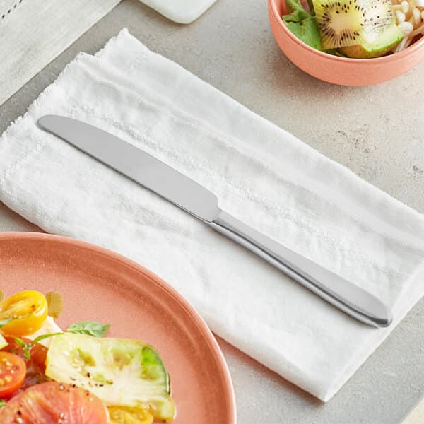 a plate of food and a knife